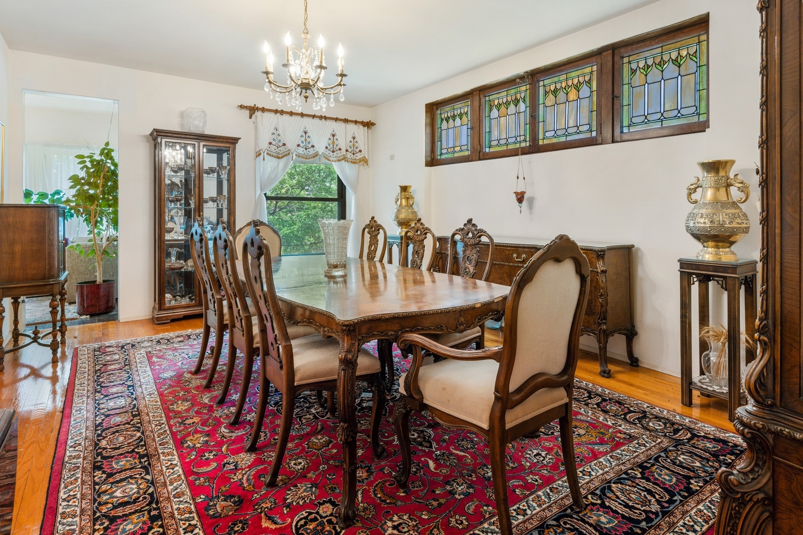 731 West Junior Terrace Chicago, IL 60613 - Photo 12 of 30 a view of a dining room with furniture window and wooden floor