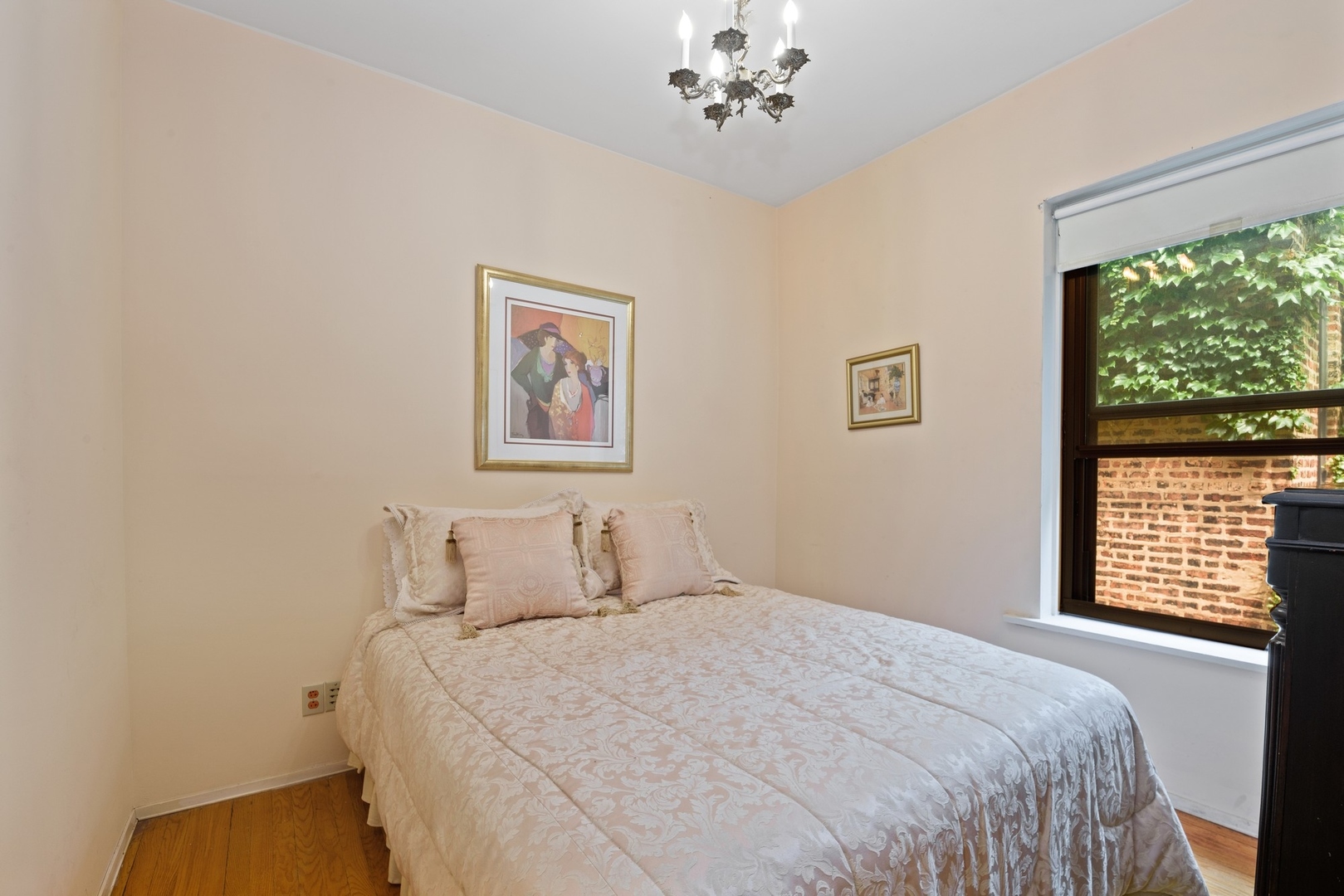 731 West Junior Terrace Chicago, IL 60613 - Photo 17 of 30 a bedroom with a large bed and a window