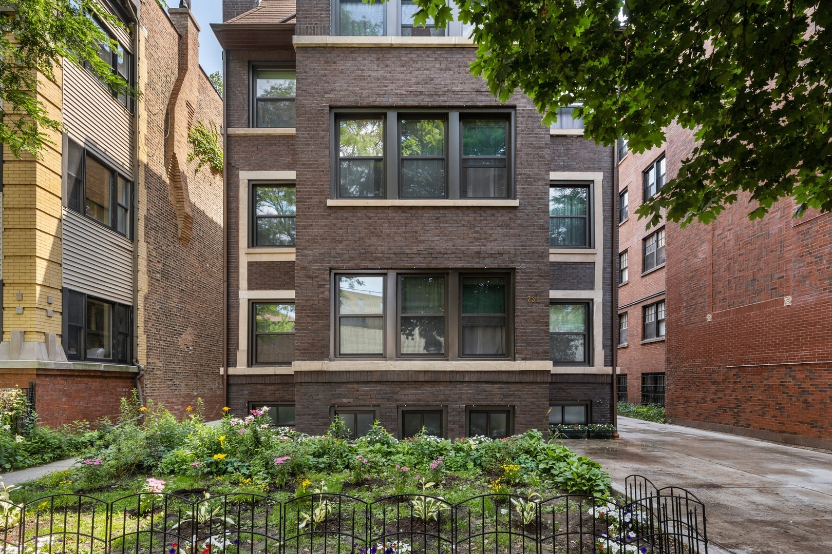 731 West Junior Terrace Chicago, IL 60613 - Photo 2 of 30 front view of a brick house with a small yard