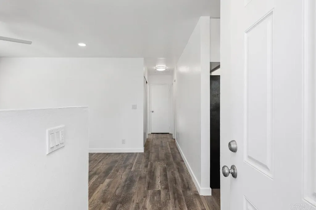 889 Bracero Road Encinitas, CA 92024 - Photo 29 of 59 a view of a hallway with wooden floor and closet