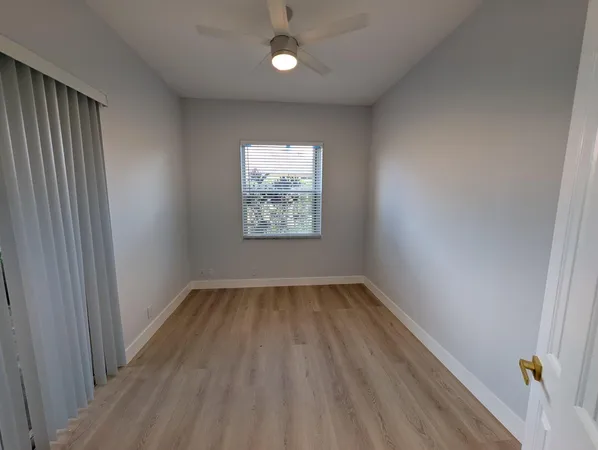 a view of a livingroom with storage and utility room