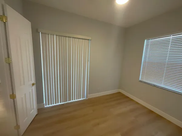 a bathroom with a toilet sink shower and mirror