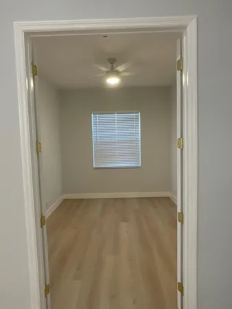 a view of a bathroom with mirror