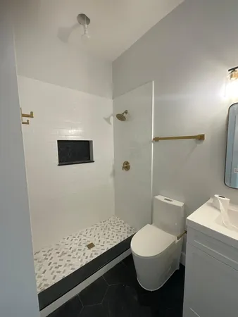 a view of hallway with wooden floor