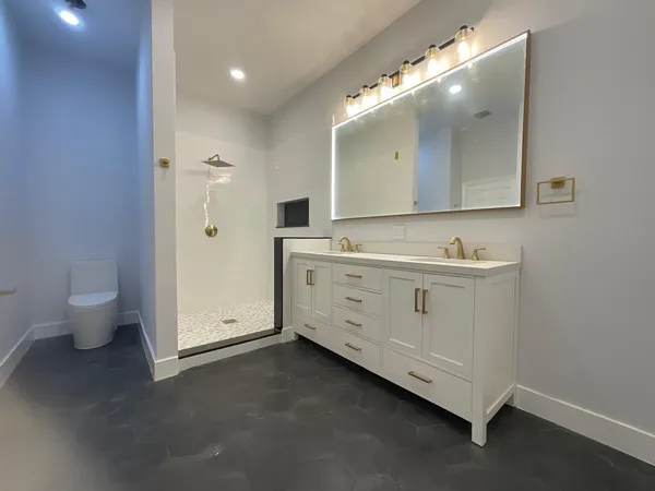 an empty room with a empty space and windows