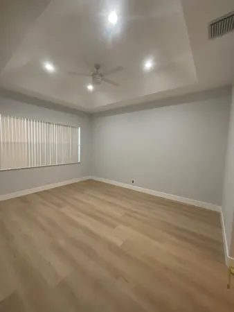 a kitchen with stainless steel appliances granite countertop a refrigerator a stove top oven a sink and dishwasher