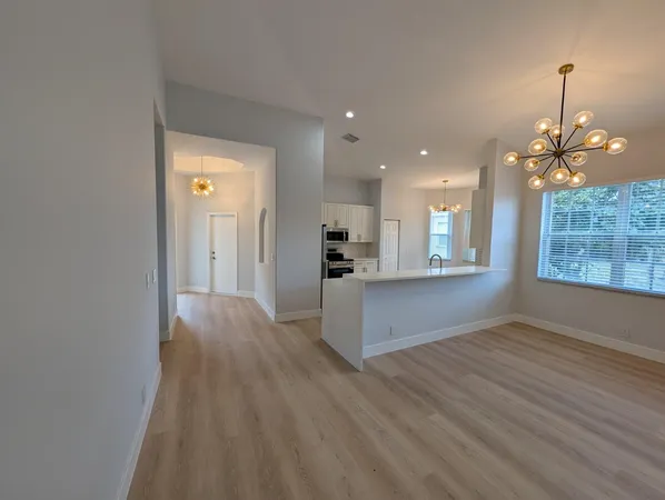 a kitchen with stainless steel appliances kitchen island a large island in the center and stainless steel appliances