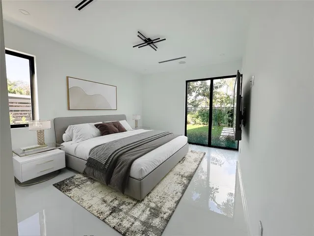 a living room with stainless steel appliances kitchen island granite countertop furniture and a view of kitchen