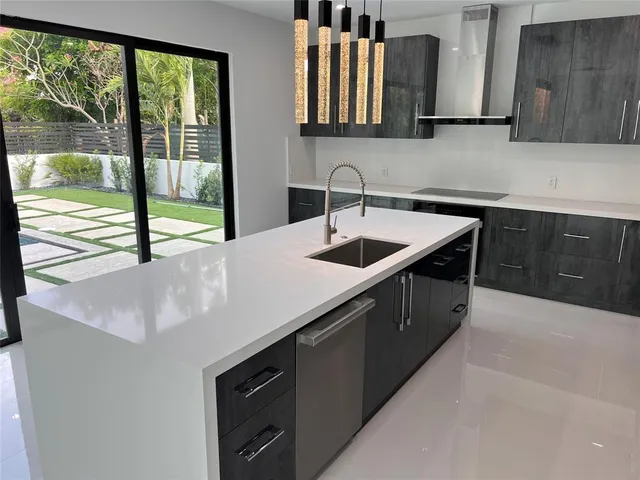 an empty room with windows and outdoor view