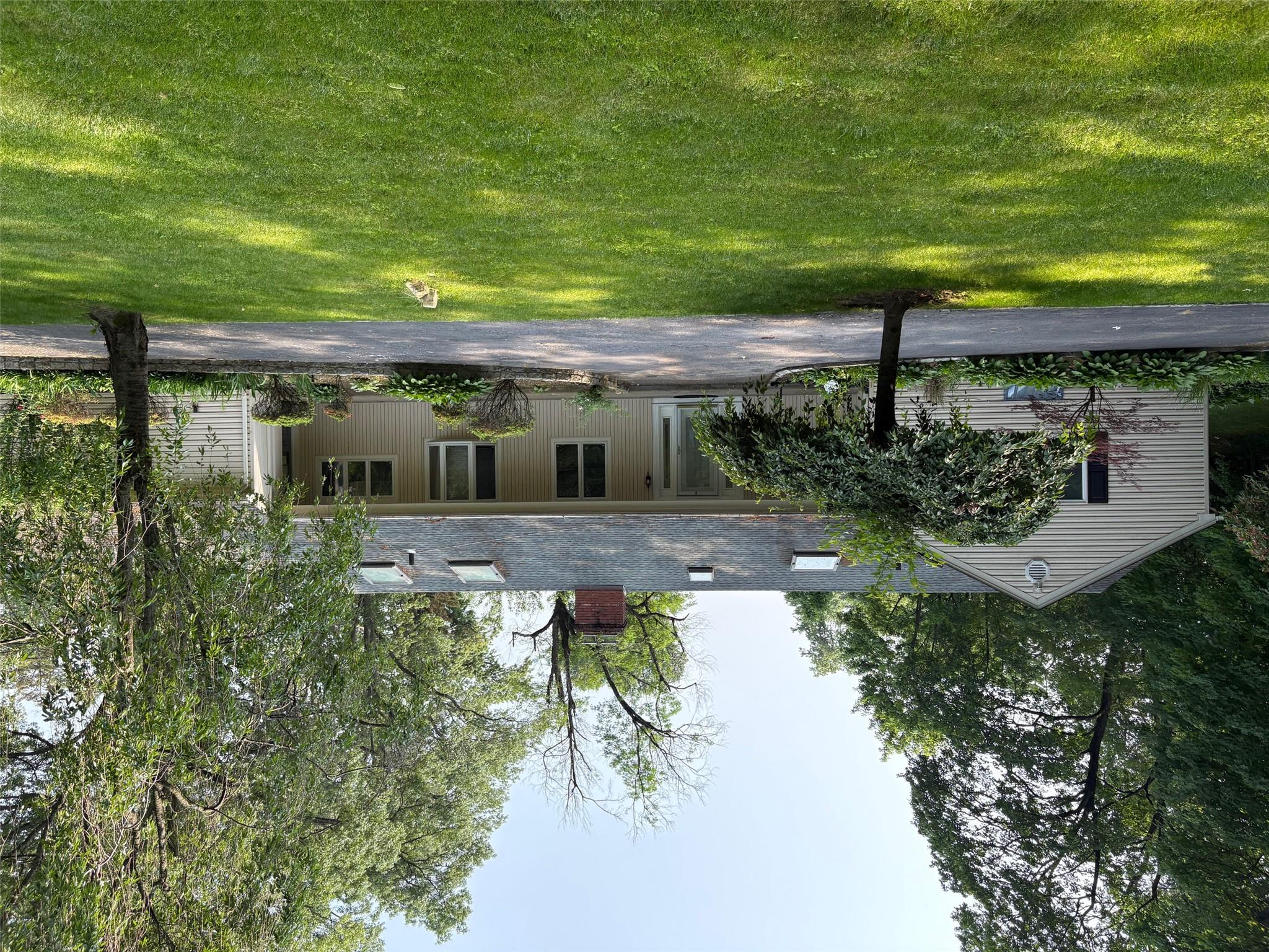 a front view of house with yard and entertaining space