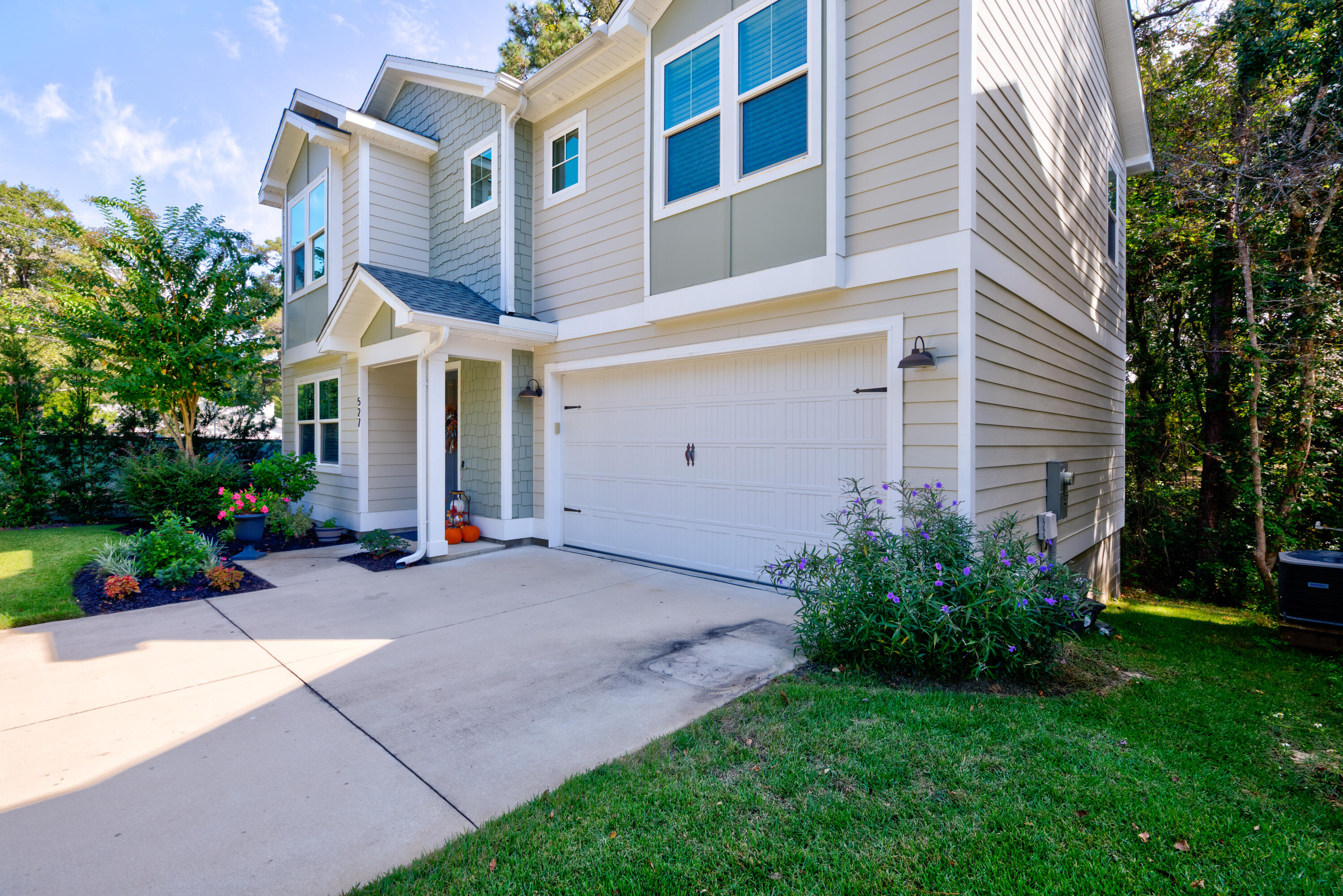527 Maple Avenue Niceville, FL 32578 - Photo 2 of 42 a view of a house with a yard and potted plants
