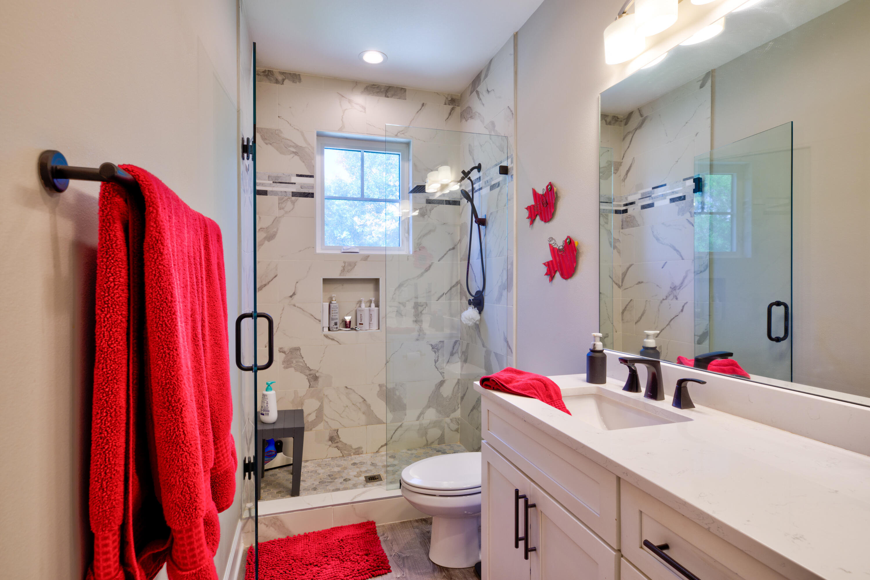 527 Maple Avenue Niceville, FL 32578 - Photo 24 of 42 a bathroom with a sink toilet and shower