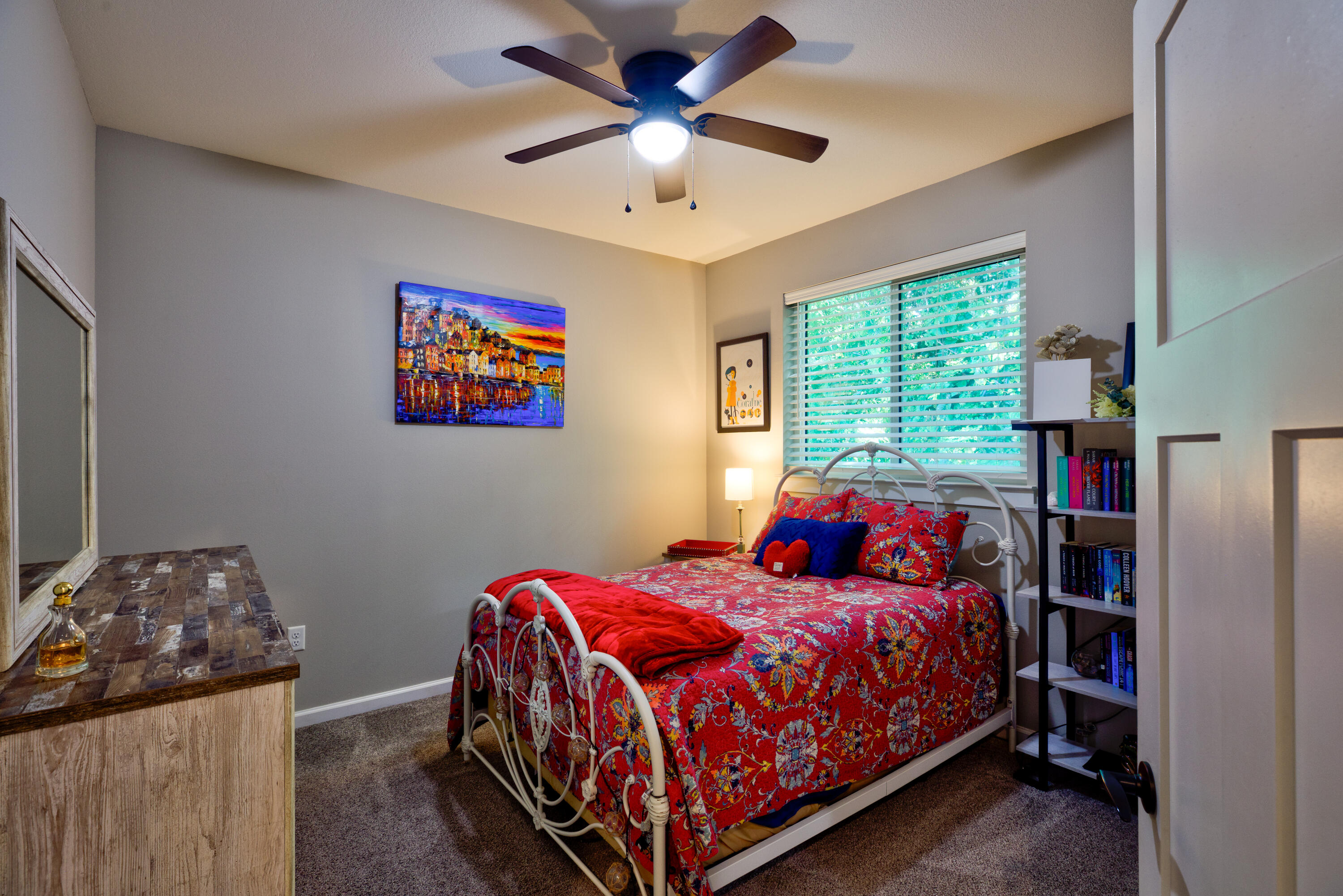 527 Maple Avenue Niceville, FL 32578 - Photo 26 of 42 a bedroom with a bed and a chandelier