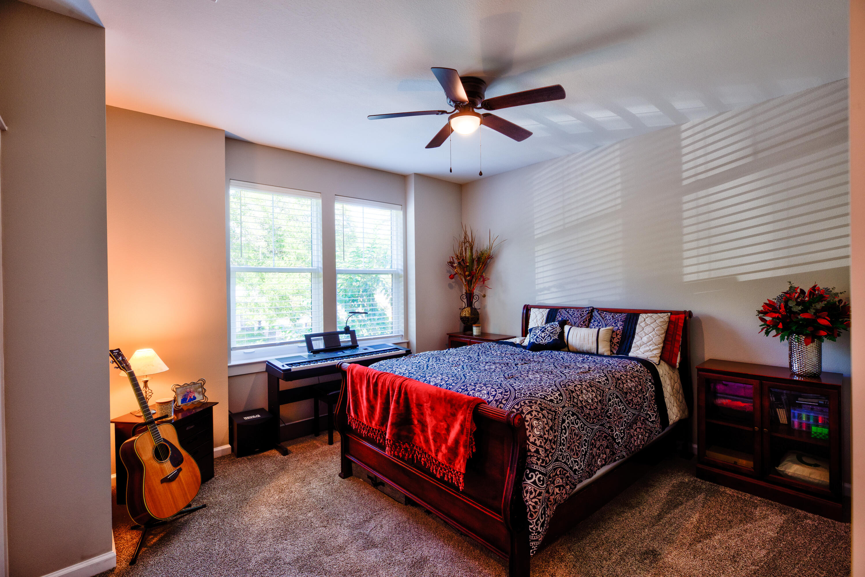 527 Maple Avenue Niceville, FL 32578 - Photo 30 of 42 a bedroom with a bed and a chandelier