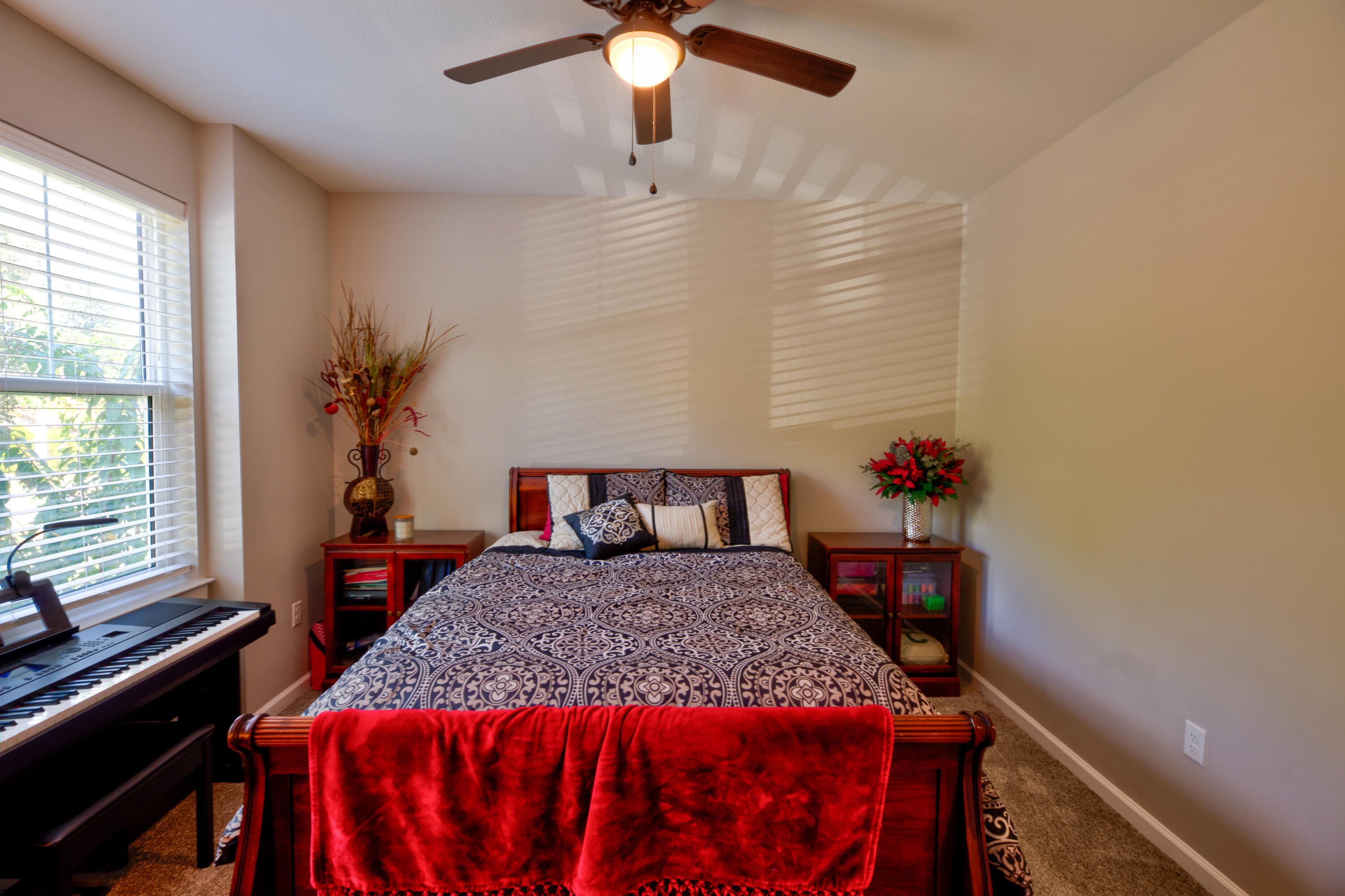 527 Maple Avenue Niceville, FL 32578 - Photo 31 of 42 a bedroom with a bed and a chandelier
