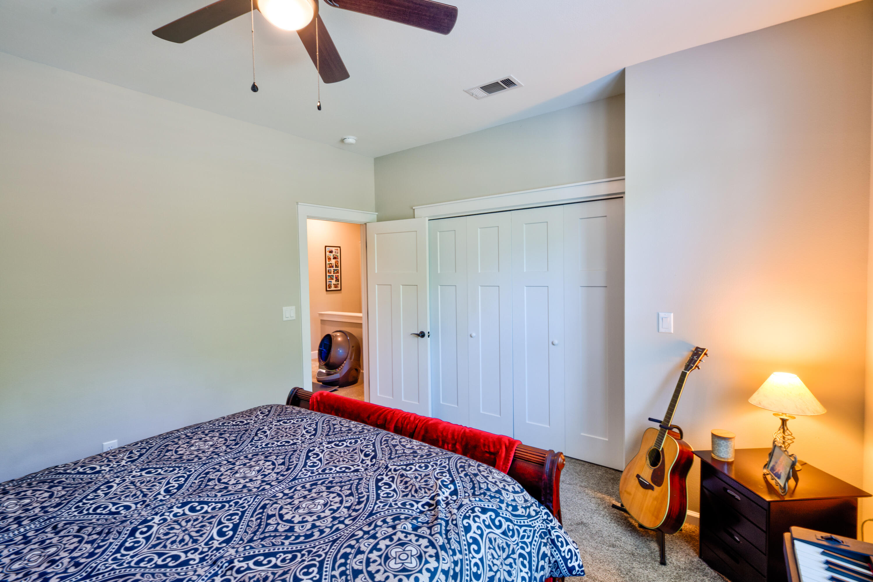 527 Maple Avenue Niceville, FL 32578 - Photo 33 of 42 a bedroom with a bed and a chandelier