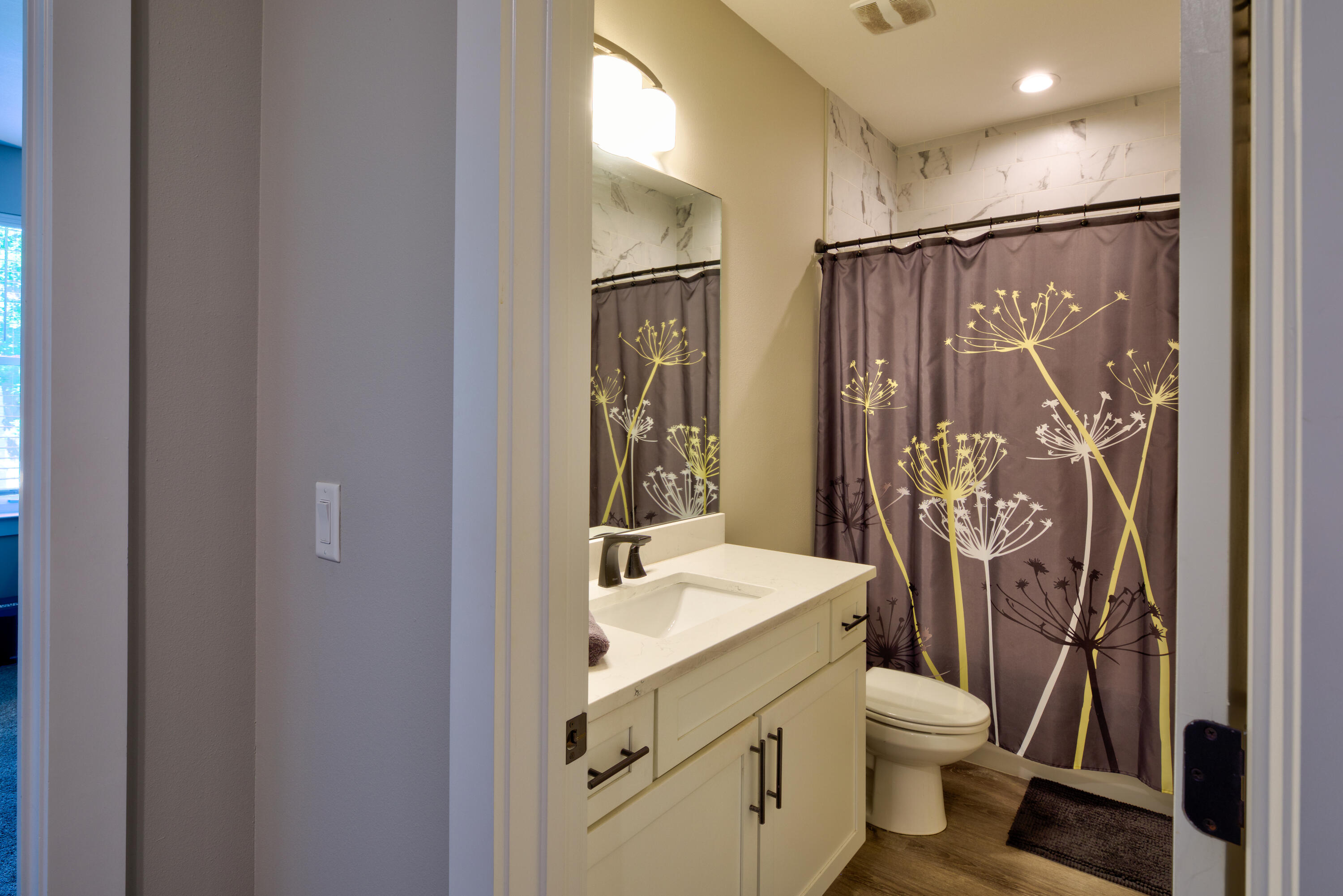 527 Maple Avenue Niceville, FL 32578 - Photo 34 of 42 a bathroom with a shower toilet and sink