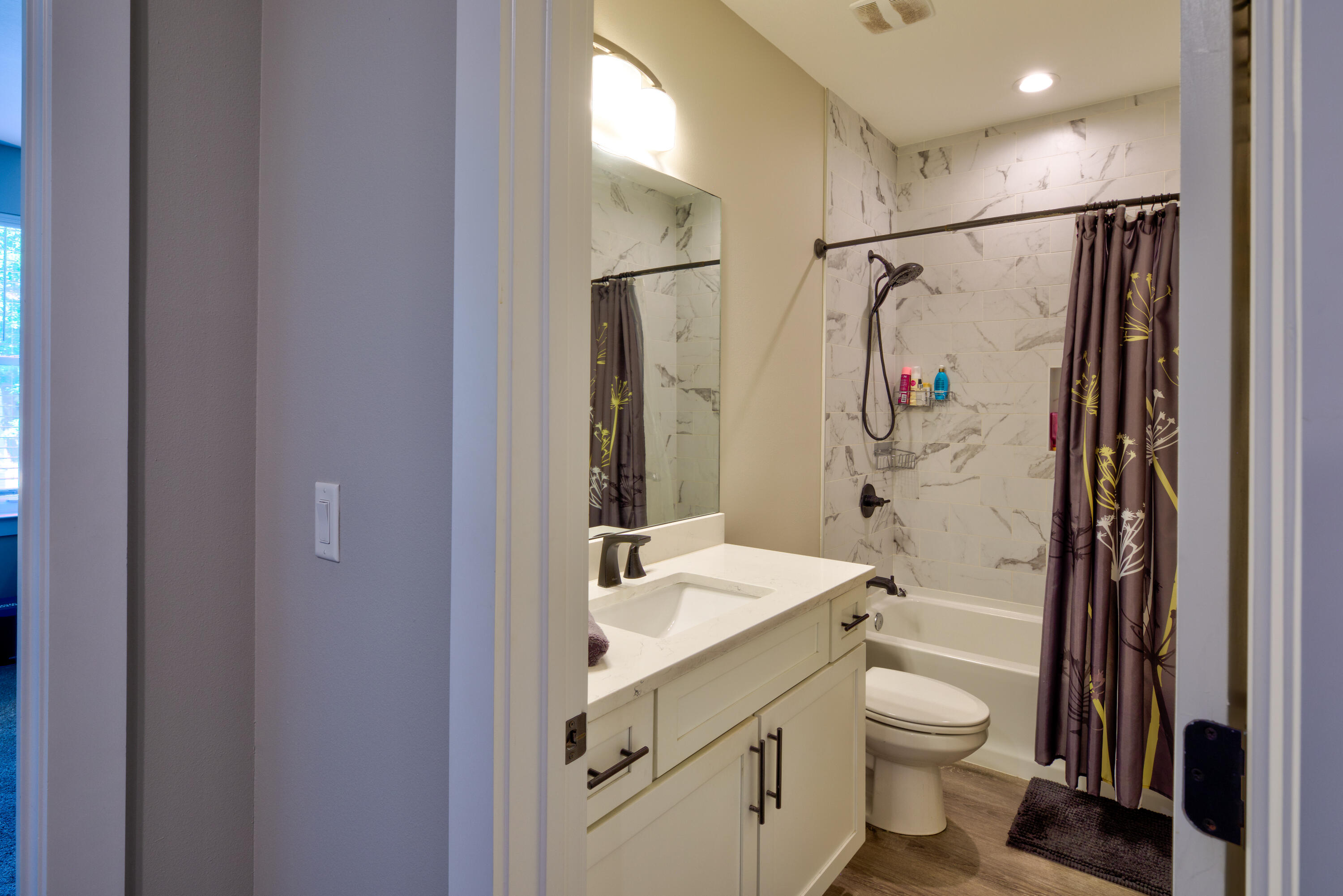 527 Maple Avenue Niceville, FL 32578 - Photo 35 of 42 a bathroom with a shower sink vanity mirror and toilet