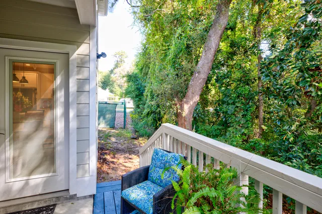 a front view of a house with yard and green space