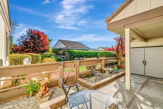 a view of a balcony with wooden floor