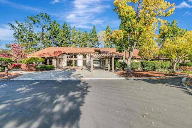 a view of swimming pool with outdoor seating and plants