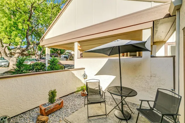a view of patio with furniture