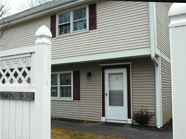 a view of a house with a door and a large window