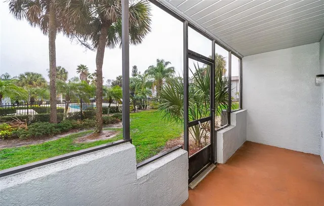 a view of a swimming pool with a patio