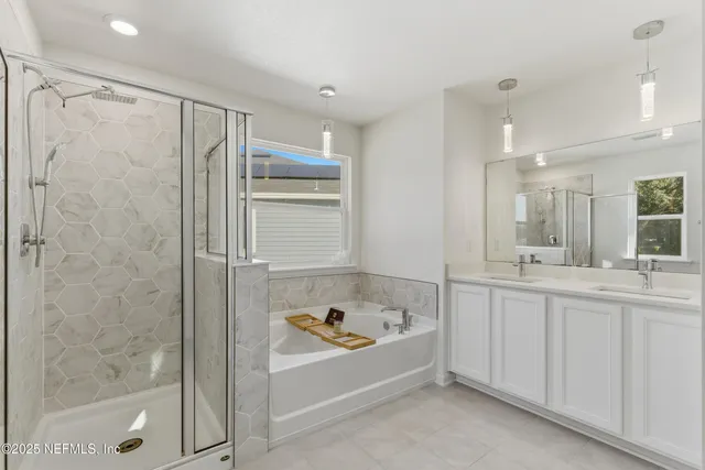a bathroom with a bathtub and a shower