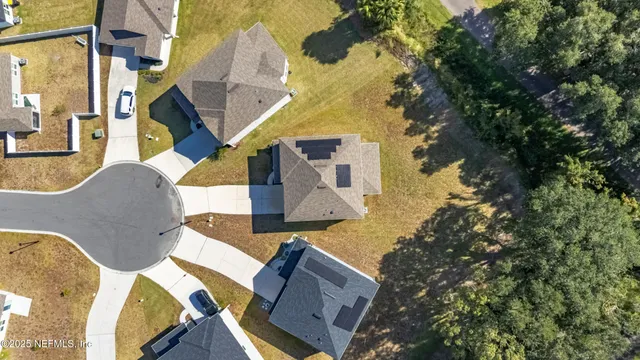 an aerial view of a house with swimming pool