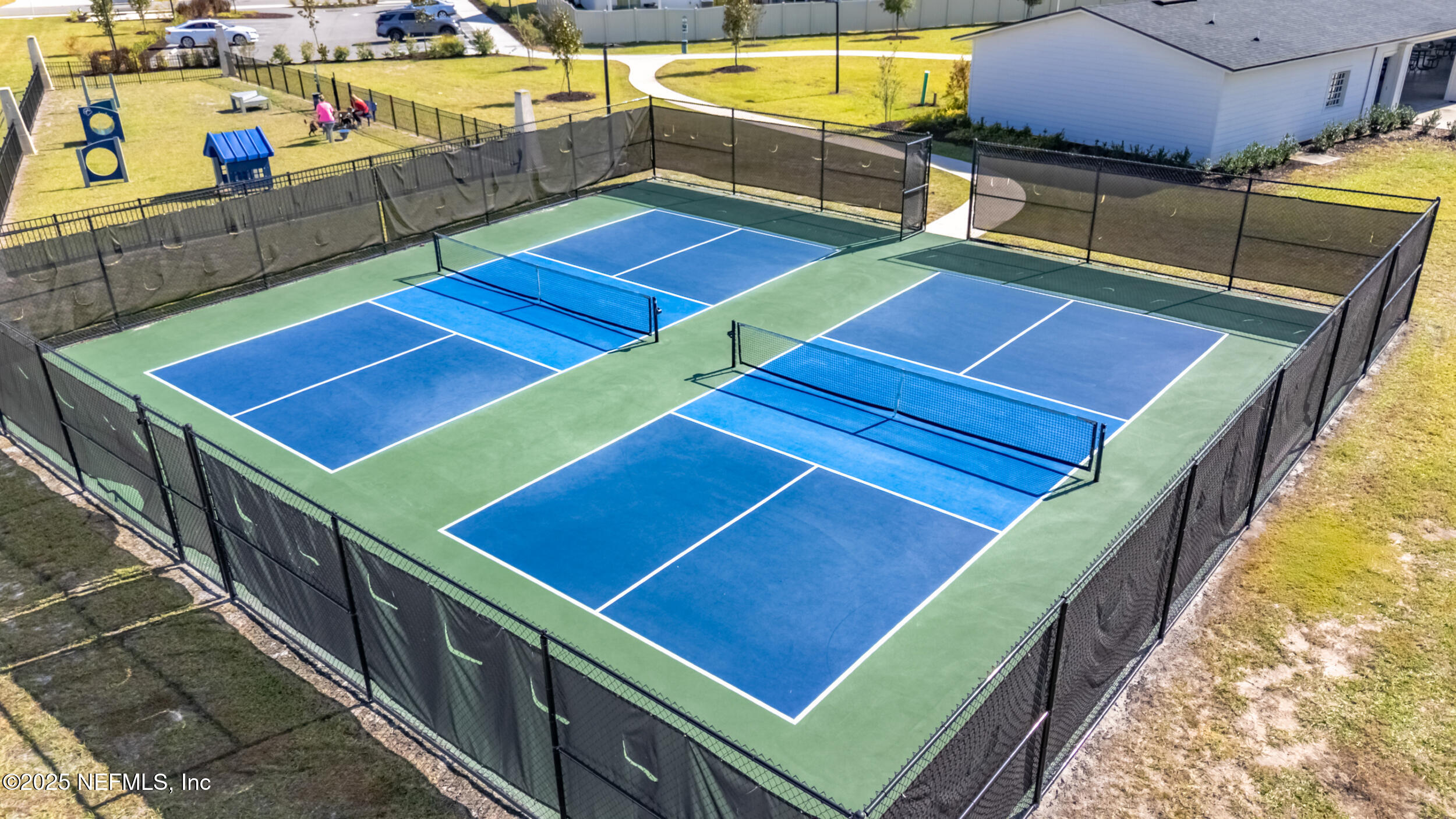 11624 Double Eagle Court Jacksonville, FL 32221 - Photo 45 of 53 a view of a tennis court with a chair