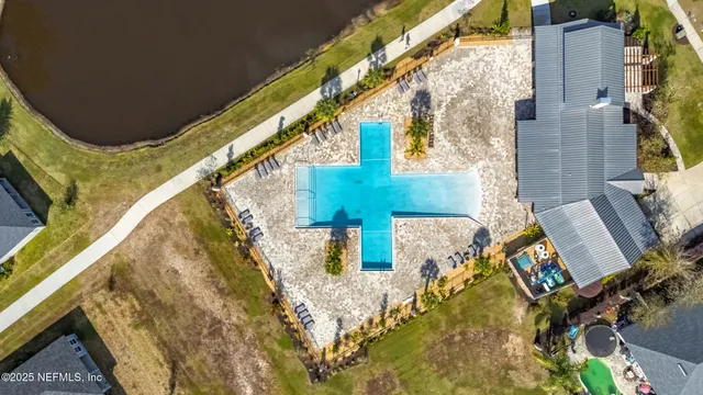 an aerial view of residential houses with outdoor space