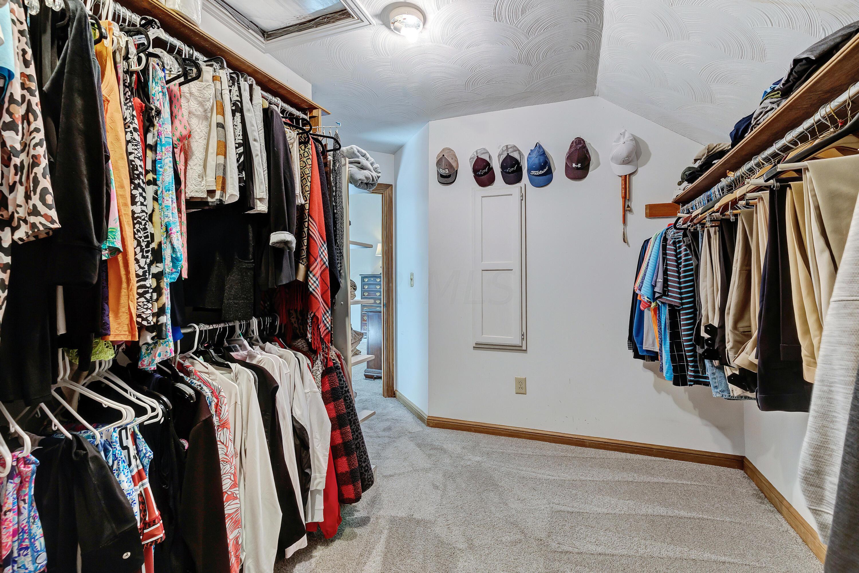 10640 Center Village Road Galena, OH 43021 - Photo 28 of 80 • New light sand carpet ~ 2022 • Ivory painted walls • Ceiling light • Attic access • Built-in ironing board