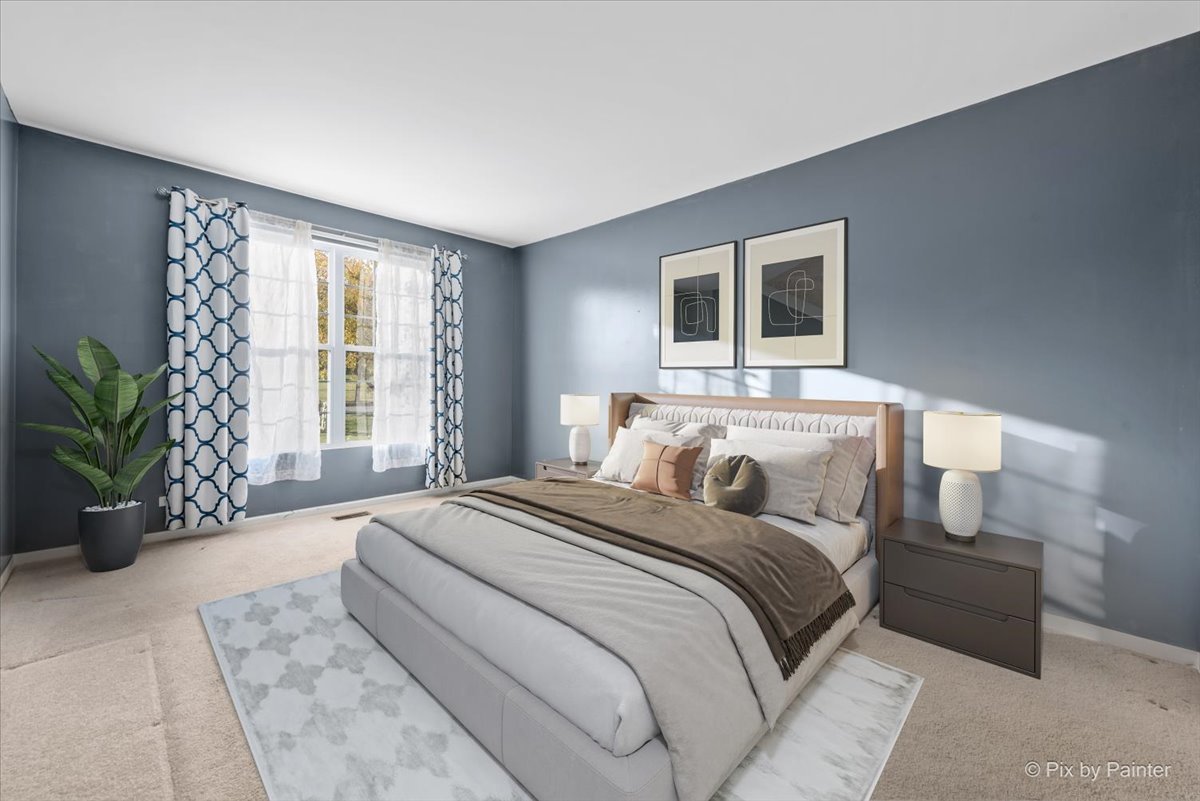 2237 Concord Drive, Unit 2237 McHenry, IL 60050 - Photo 11 of 19 a bedroom with a large bed and a couch