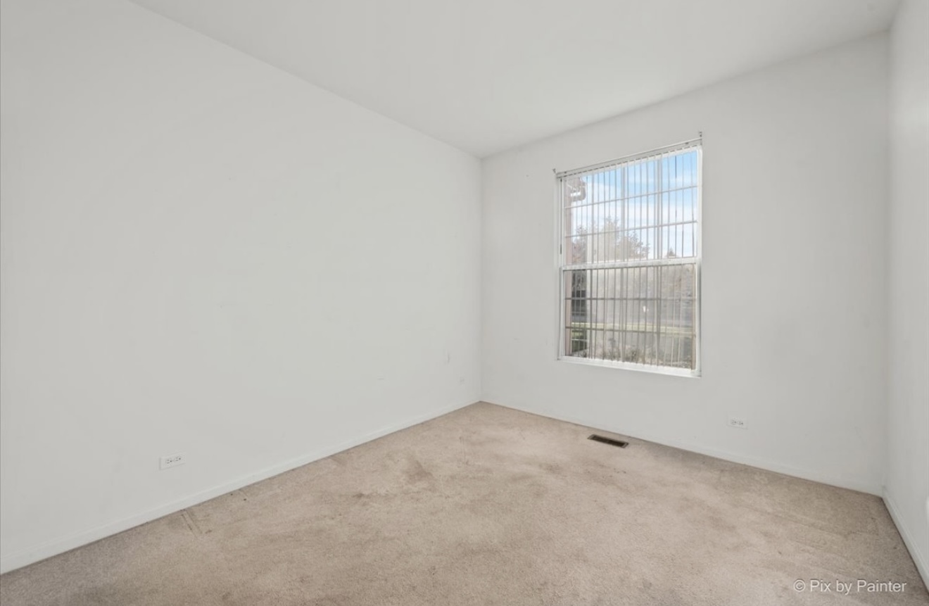 2237 Concord Drive, Unit 2237 McHenry, IL 60050 - Photo 16 of 19 an empty room with a window