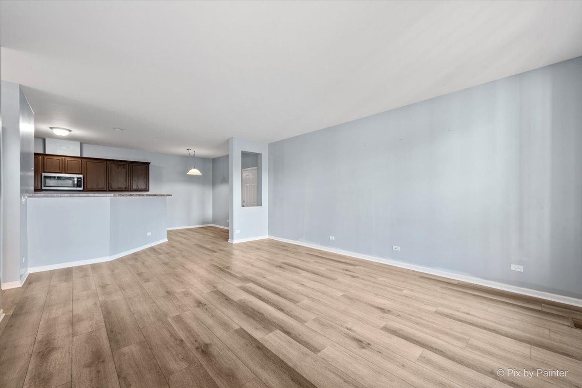 2237 Concord Drive, Unit 2237 McHenry, IL 60050 - Photo 4 of 19 a view of empty room with wooden floor