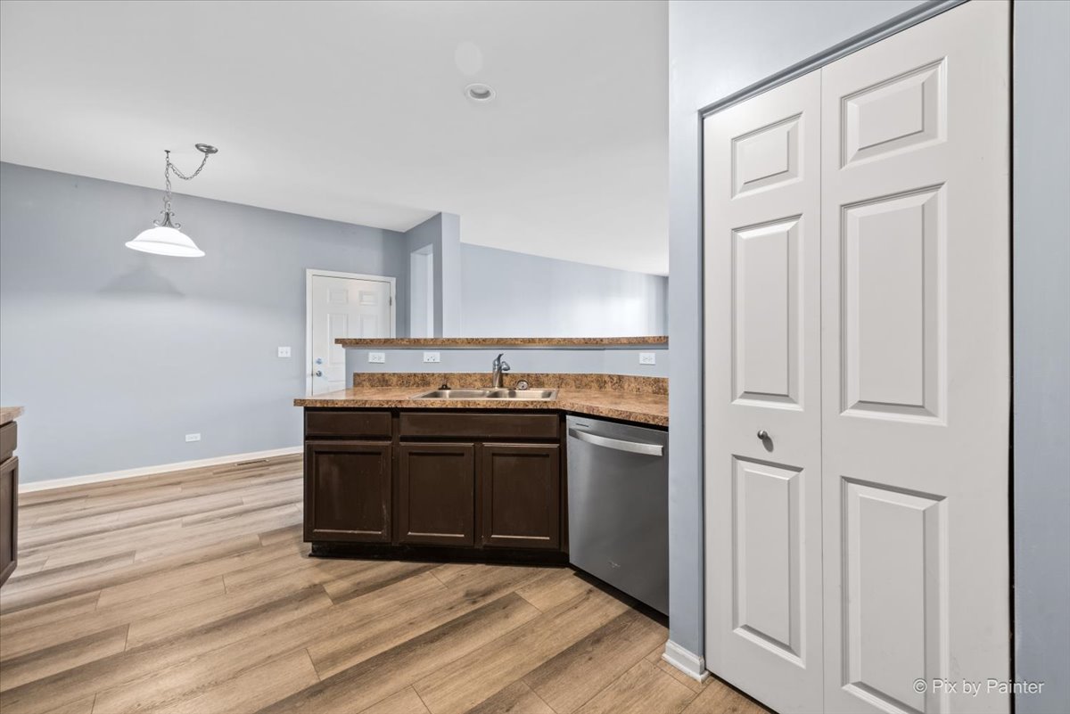 2237 Concord Drive, Unit 2237 McHenry, IL 60050 - Photo 9 of 19 a kitchen with stainless steel appliances granite countertop a stove and a refrigerator