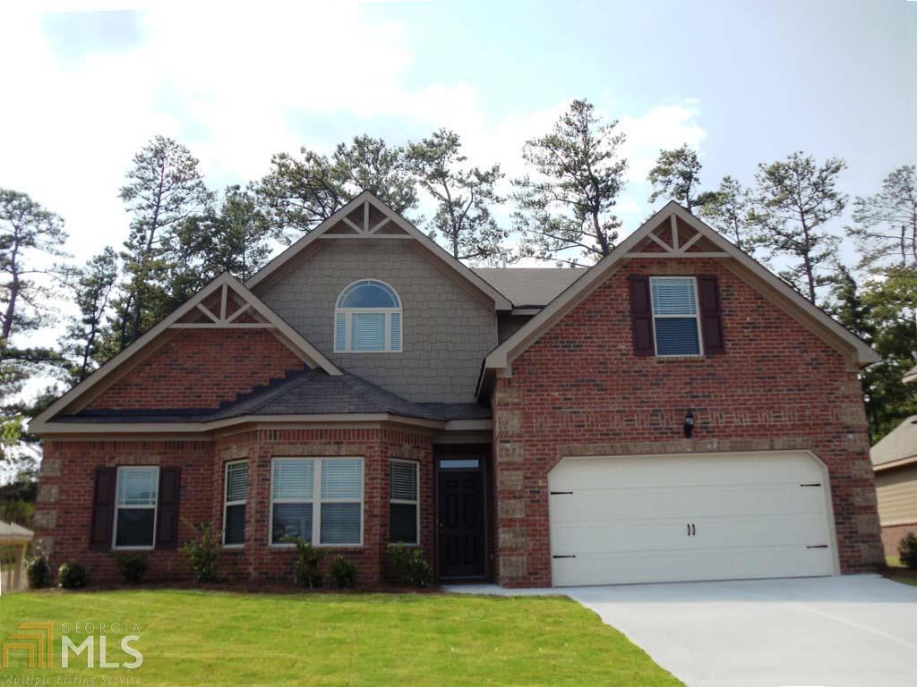 5760 Country Lake Road, Unit 2 Cumming, GA 30041 - Photo 1 of 1 a front view of a house with a garden