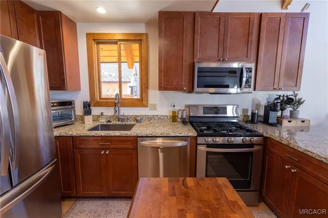 a view of a livingroom with furniture stairs and a couch