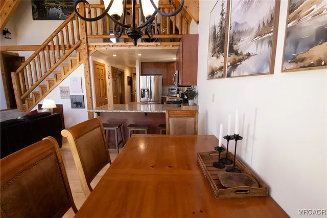 a view of a living room and dining area