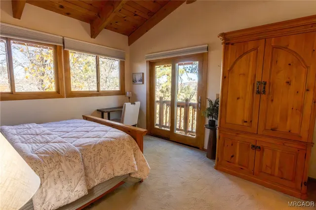 a spacious bedroom with a bed and a table