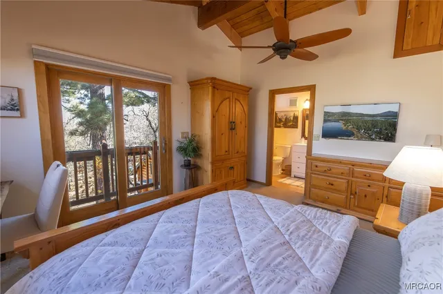 a bathroom with a sink vanity and toilet