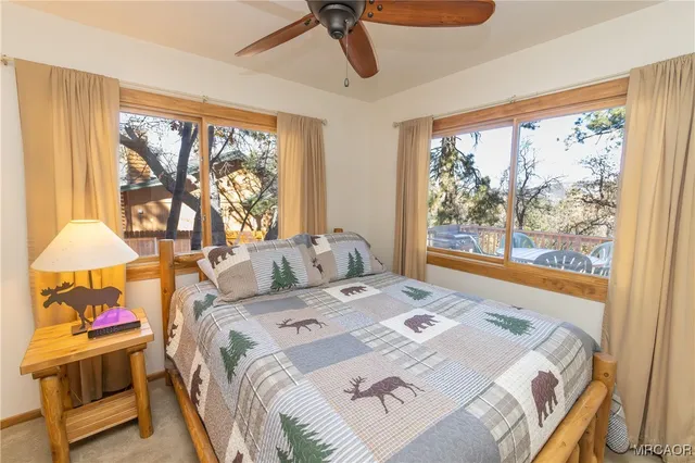 a bed room with a bed and a window