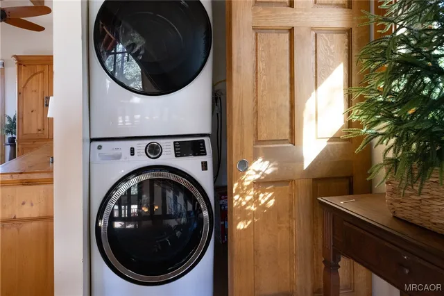 a living room with a table and a rug