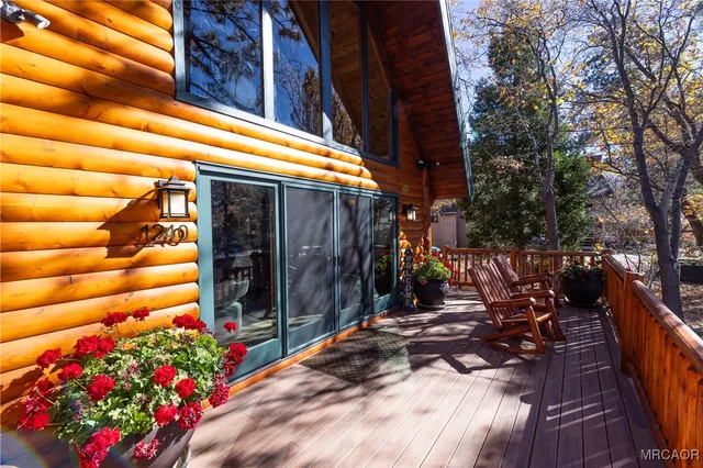a view of path along with flowers and trees