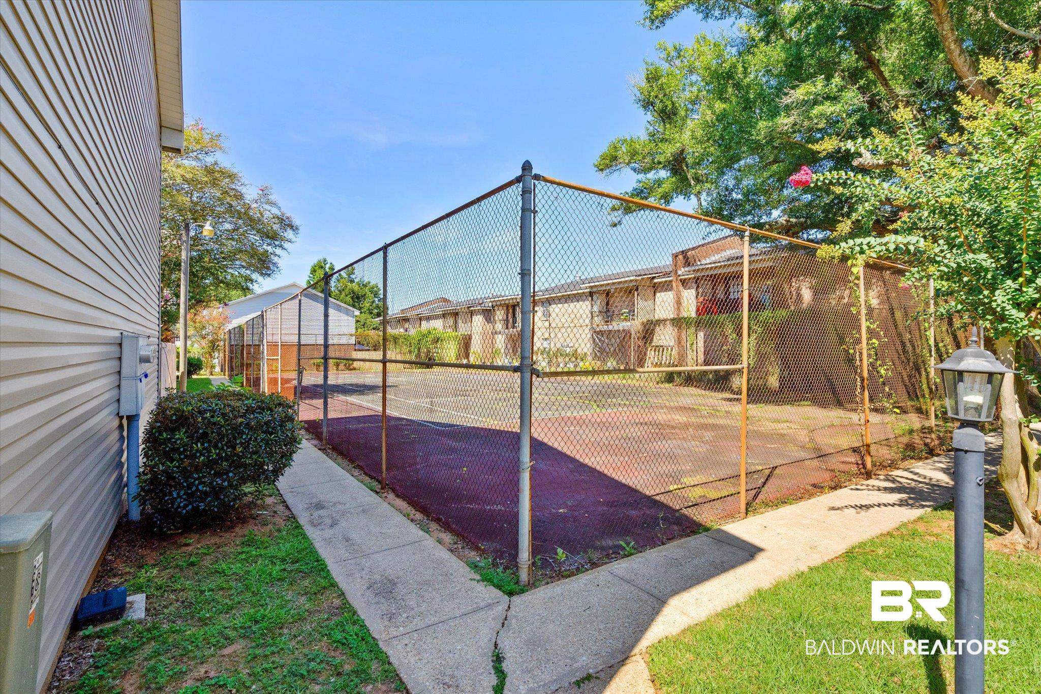 4017 Cottage Hill Road, Unit 59 Mobile, AL 36609 - Photo 23 of 25 View of basketball court with a yard