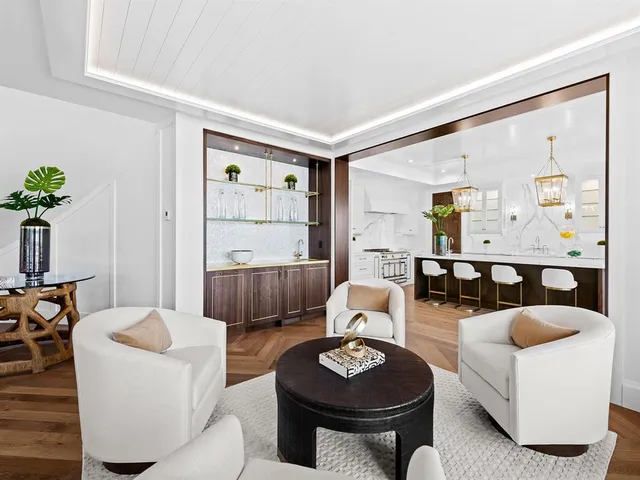 a spacious bathroom with double vanity and mirrors