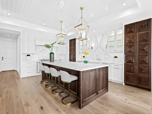 a spacious bedroom with a large bed and a large window