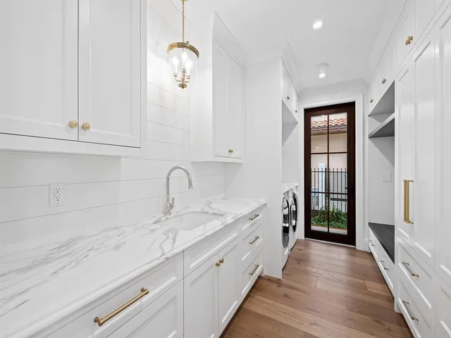 a bathroom with a bathtub and a sink