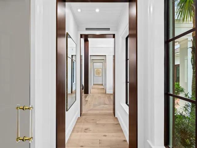 a kitchen with a sink cabinets and wooden floor